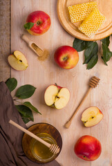 Jewish holiday Rosh Hashana background with apples and honey on blackboard. View from above. Flat lay