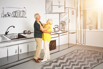 Happy mature couple dancing in their new house