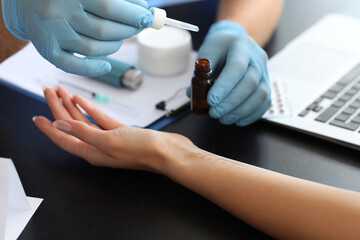 Young woman undergoing allergen skin test in clinic, closeup