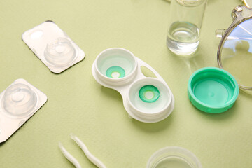 Composition with contact lenses and accessories on color background