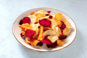 Healthy vegetable chips in a plate, healthy vegan snack
