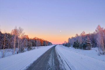 Fototapeta na wymiar winter road in beautiful sunset