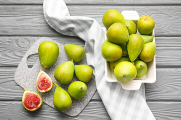 Fresh green figs on wooden background