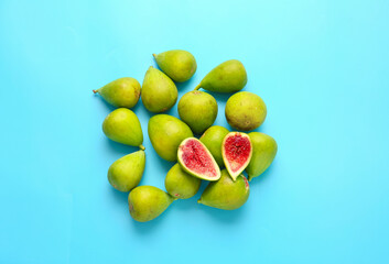 Fresh green figs on color background