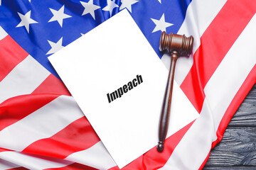 Paper with word IMPEACH, USA flag and judge gavel on wooden background