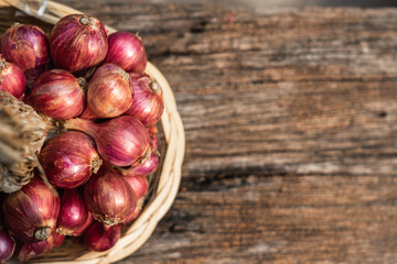 Fresh red onion on rustic wooden table