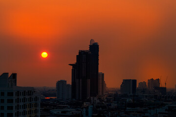 Fototapeta premium The high angle background of the city view with the secret light of the evening, blurring of night lights, showing the distribution of condominiums, dense homes in the capital community