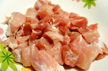 raw meat in a white plate close up