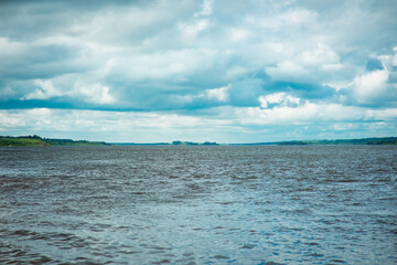 landscape with a river and a stormy sky, selective focus