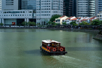 Touristic cruise at Boat Quay, downtown Singapore 