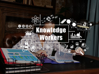 Conceptual photo about Knowledge Workers with written phrase. Cheerful young businesswoman working at desk in office on background.