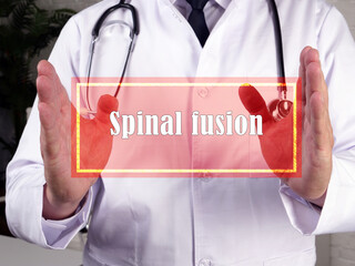  Spinal fusion arthrodesis inscription on the piece of paper.