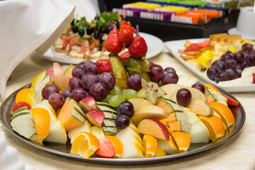 Food snacks and appetizers with cheese, meat  on table. Catering banquet table. Catering party. Corporate event or wedding celebration.