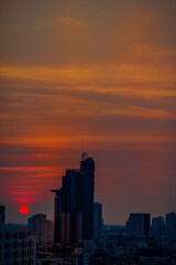 Fototapeta premium The high angle background of the city view with the secret light of the evening, blurring of night lights, showing the distribution of condominiums, dense homes in the capital community
