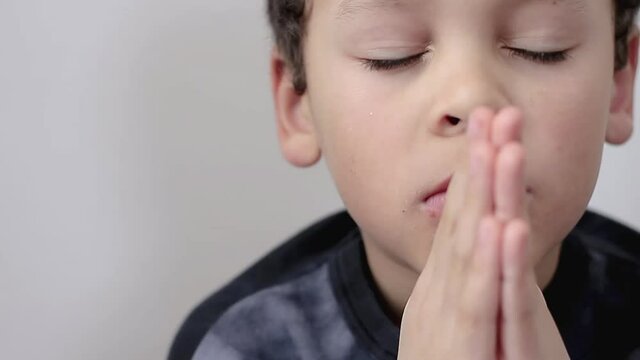 little boy praying to God with hands together stock video stock footage