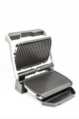 electric grill with open lid. appliance for cooking in everyday life. Made of stainless steel, special non-stick coating. healthy food. food without oil and fat. 