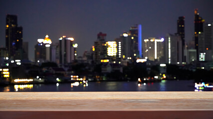 View from wooden planks over Bangkok town at night