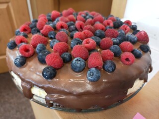 cake with fruits, raspberries, blueberries, chocolate