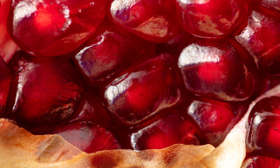 Ripe red pomegranate as background.