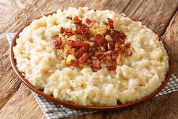 Estonian national dish Mulgipuder or potato pearl barley porridge. close-up in a plate on the table. horizontal