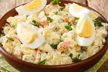 Kartulisalat Potato salad Estonian Cooking and Eating closeup in the bowl on the table. horizontal