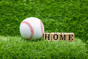 Baseball is on green grass background