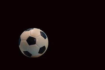 Soccer ball is on black background