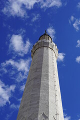 Fototapeta na wymiar Minaret of mosque in the clouds, minaret aspiring to heaven