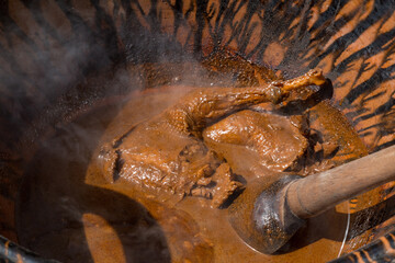 High angle shot of a pot of traditional Mexican food with Mole Poblano