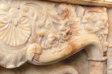 Carved patterns on stone luxury fireplace close up