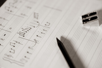 orchestral or piano score written by a music master, music written in pencil on a stave, detail of...