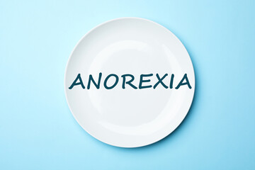 Anorexia concept. ceramic plate on color background, top view