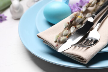 Festive Easter table setting with egg on white background, closeup