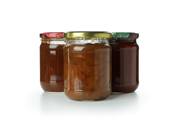 Jars with different canned jam isolated on white background