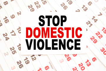 text STOP DOMESTIC VIOLENCE on a sheet from Notepad.a digital background. business concept . business and Finance.