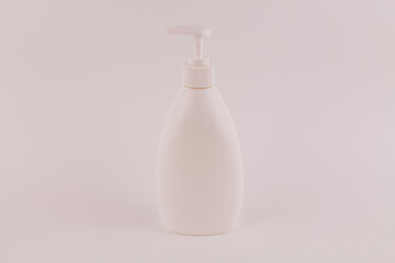 container for cream with a dispenser on a white background