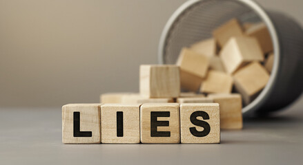 lies - word concept from wooden blocks on desk