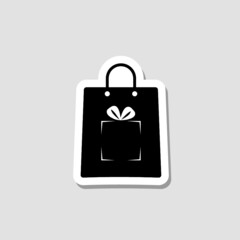 Shopping bag with gift box sticker icon