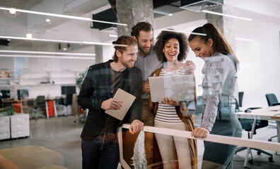 Programmers cooperating at IT company developing apps