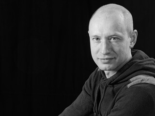 Fototapeta premium bw portrait of a bald man on a black background