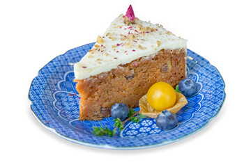 A piece of carrot cake on ceramic plate, focus selective.