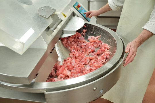Cutter for chopping meat at a meat processing plant. Industrial cutter at the factory where sausages are made. Huge stainless-steel pars for meat processing. Industrial equipment. Food industry.