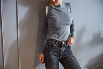 Person putting her hand in jeans pocket