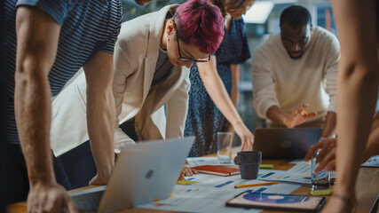 Diverse Multi-Ethnic Team of Professional Businesspeople Meeting in the Modern Office Conference...