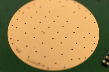 Old button mobile phone circular contact pad of a printed circuit board underside