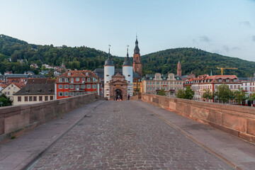 Sunrise view of the old bridge gate in Heidelberg, Germany