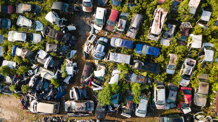 Scrapyard Aerial View. Old rusty corroded cars in car junkyard. Car recycling industry from above.