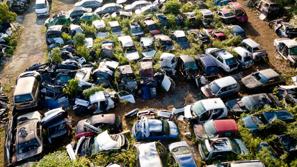 Scrapyard Aerial View. Old rusty corroded cars in car junkyard. Car recycling industry from above.