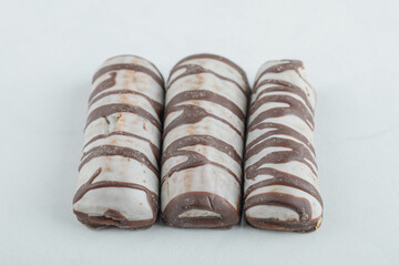 Delicious chocolate bars on a white background