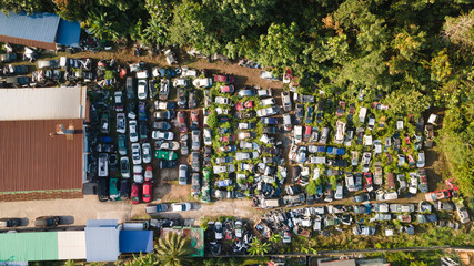 Scrapyard Aerial View. Old rusty corroded cars in car junkyard. Car recycling industry from above.